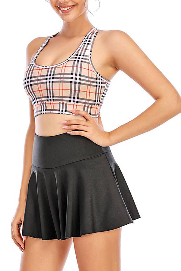 Solid color athletic skorts feature under shorts w/pockets