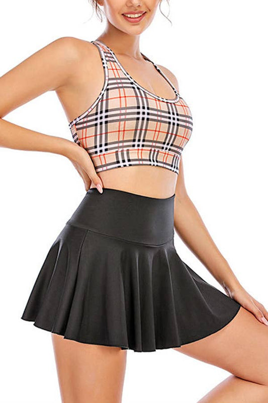 Solid color athletic skorts feature under shorts w/pockets