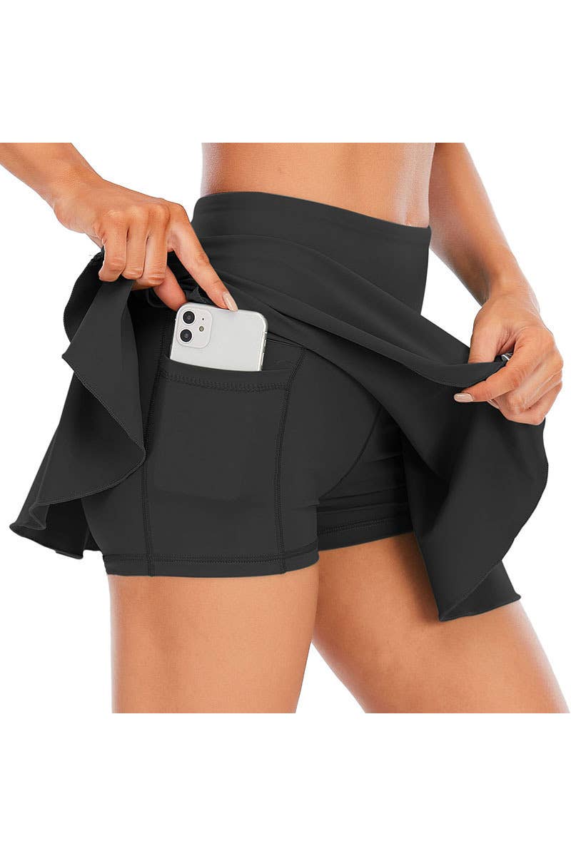 Solid color athletic skorts feature under shorts w/pockets