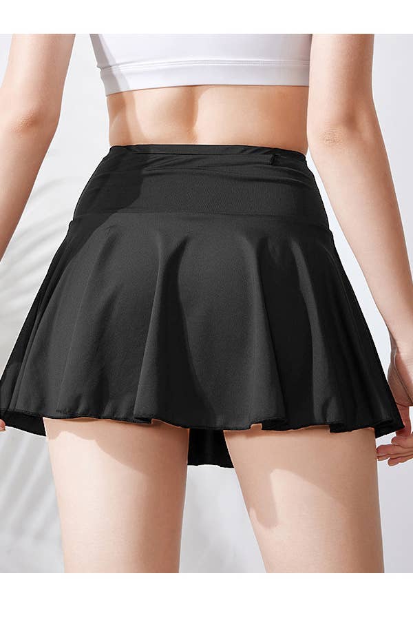 Solid color athletic skorts feature under shorts w/pockets
