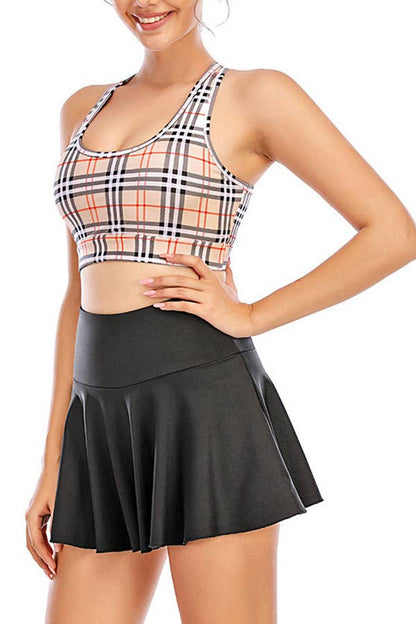 Solid color athletic skorts feature under shorts w/pockets