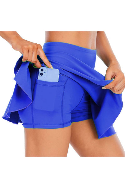 Solid color athletic skorts feature under shorts w/pockets